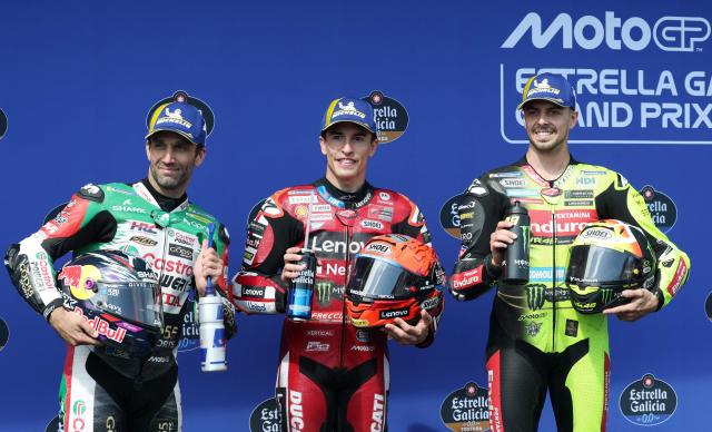 (L-R) Second placed Team LCR Honda CASTROL's Johann Zarco, first placed Team Ducati Lenovo Team's Marc Marquez and third placed Team Pertamina Enduro VR46 Racing Team's Fabio Di Giannantonio pose together after competing in the qualifying session of the MotoGP Spanish Grand Prix at the Jerez racetrack in Jerez de la Frontera, on April 25, 2026. (Photo by Pierre-Philippe MARCOU / AFP)