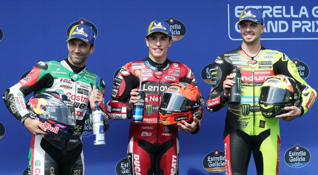 (L-R) Second placed Team LCR Honda CASTROL's Johann Zarco, first placed Team Ducati Lenovo Team's Marc Marquez and third placed Team Pertamina Enduro VR46 Racing Team's Fabio Di Giannantonio pose together after competing in the qualifying session of the MotoGP Spanish Grand Prix at the Jerez racetrack in Jerez de la Frontera, on April 25, 2026. (Photo by Pierre-Philippe MARCOU / AFP)