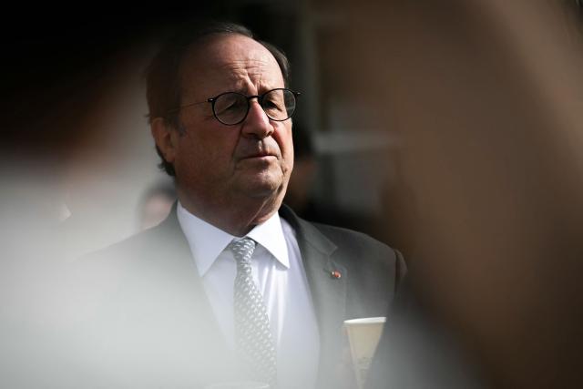 French former President and Socialistes et Apparentes' MP Francois Hollande looks on during a meeting of various figures of the left named "Printemps du souffle breton" in Liffre, western France on April 25, 2026. (Photo by Lou BENOIST / AFP)