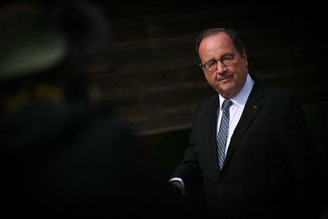 French former President and Socialistes et Apparentes' MP Francois Hollande looks on during a meeting of various figures of the left named "Printemps du souffle breton" in Liffre, western France on April 25, 2026. (Photo by Lou BENOIST / AFP)