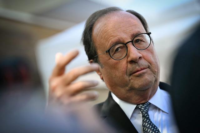 French former President and Socialistes et Apparentes' MP Francois Hollande gestures as he attends a meeting of various figures of the left named "Printemps du souffle breton" in Liffre, western France on April 25, 2026. (Photo by Lou BENOIST / AFP)