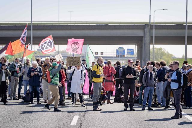 Demonstrators from Extinction Rebellion (XR), Utrecht 4 Palestine (U4P), and Debt for Climate (D4C) take part in a blockade demonstration of the Utrecht ring road in Utrech on April 25, 2026. They demand an immediate end to fossil fuel subsidies and that the money be used for housing, healthcare, decolonial reparations, and debt relief. (Photo by Jeroen JUMELET / ANP / AFP) / Netherlands OUT