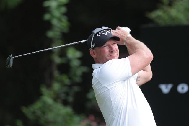 South Africa's Shaun Norris hits a tee shot during the third round of the China Open golf tournament in Shanghai on April 25, 2026. (Photo by CN-STR / AFP) / China OUT