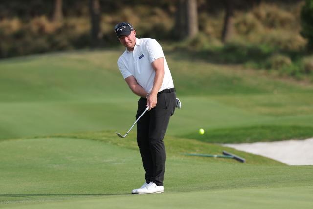 South Africa's Shaun Norris chips onto the green during the third round of the China Open golf tournament in Shanghai on April 25, 2026. (Photo by CN-STR / AFP) / China OUT
