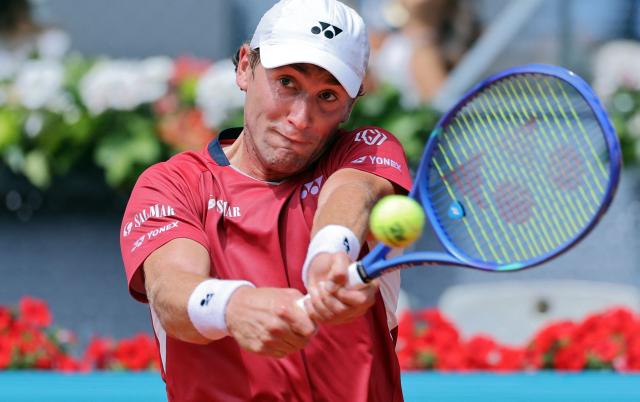Norway's Casper Ruud returns the ball to Spain's Jaume Munar during their 2026 ATP Tour Madrid Open tennis tournament third round singles match at the Caja Magica in Madrid, on April 25, 2026. (Photo by Thomas COEX / AFP)