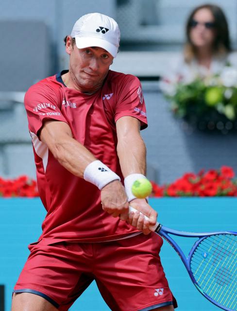 Norway's Casper Ruud returns the ball to Spain's Jaume Munar during their 2026 ATP Tour Madrid Open tennis tournament third round singles match at the Caja Magica in Madrid, on April 25, 2026. (Photo by Thomas COEX / AFP)