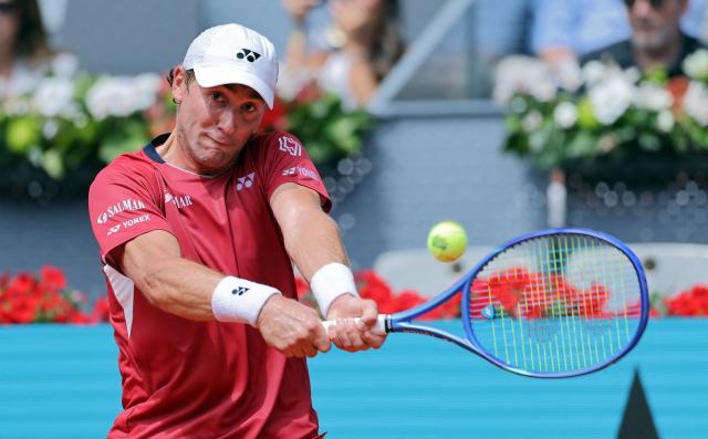 Norway's Casper Ruud returns the ball to Spain's Jaume Munar during their 2026 ATP Tour Madrid Open tennis tournament third round singles match at the Caja Magica in Madrid, on April 25, 2026. (Photo by Thomas COEX / AFP)