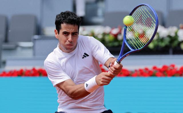 Spain's Jaume Munar returns the ball to Norways Casper Ruud during their 2026 ATP Tour Madrid Open tennis tournament third round singles match at the Caja Magica in Madrid, on April 25, 2026. (Photo by Thomas COEX / AFP)