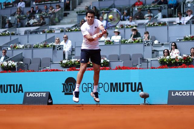 Spain's Jaume Munar returns the ball to Norways Casper Ruud during their 2026 ATP Tour Madrid Open tennis tournament third round singles match at the Caja Magica in Madrid, on April 25, 2026. (Photo by Thomas COEX / AFP)