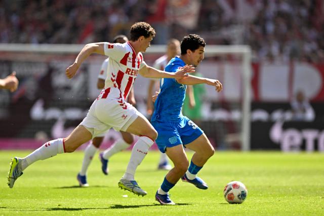 FC Cologne's Bosnian midfielder #08 Denis Huseinbasic (L) and Bayer Leverkusen's Algerian midfielder #30 Ibrahim Maza vie for the ball during the German first division Bundesliga football match 1 FC Cologne v Bayer 04 Leverkusen in Cologne, western Germany, on April 25, 2026. (Photo by INA FASSBENDER / AFP) / DFL REGULATIONS PROHIBIT ANY USE OF PHOTOGRAPHS AS IMAGE SEQUENCES AND/OR QUASI-VIDEO