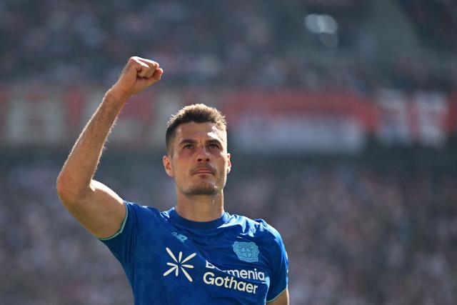 Bayer Leverkusen's Czech forward #14 Patrik Schick celebrates scoring his team's first goal during the German first division Bundesliga football match 1 FC Cologne v Bayer 04 Leverkusen in Cologne, western Germany, on April 25, 2026. (Photo by INA FASSBENDER / AFP) / DFL REGULATIONS PROHIBIT ANY USE OF PHOTOGRAPHS AS IMAGE SEQUENCES AND/OR QUASI-VIDEO