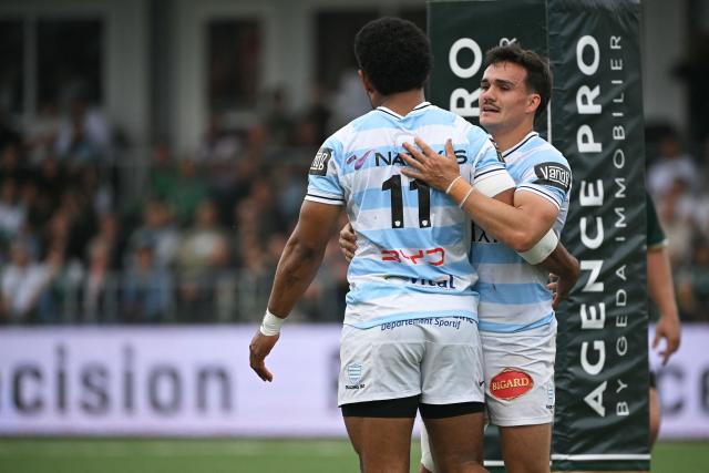 Racing 92' Fijian winger  Wame Naituvi (L) celebrates with Racing 92' French full-back Max Spring  after scoring a try  during the French Top14 rugby union match between US Montauban and Racing 92 at Stade Sapiac in Montauban, south-western France on April 25, 2026. (Photo by Matthieu RONDEL / AFP)