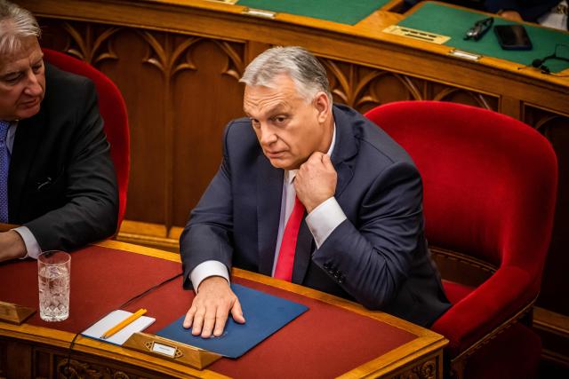 (FILES) Hungarian Prime Minister Viktor Orban is pictured after delivering a speech in the Hungarian Parliament in Budapest on February 24, 2025. Hungary's outgoing nationalist prime minister Viktor Orban said on April 25, 2026 he would step back from parliament after his coalition suffered a crushing election defeat that ended his 16 years in power. "Since the seat I won as the lead candidate on the Fidesz-KDNP ticket is, in fact, a parliamentary seat for Fidesz, I have decided to give it back. Right now, I am not needed in Parliament, but in the reorganization of the national camp" he said in a Facebook video. (Photo by Ferenc ISZA / AFP)