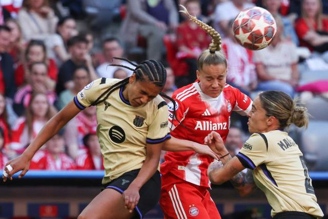 Barcelona's Dutch midfielder #24 Esmee Brugts (L-R) Bayern Munich's German defender #07 Giulia Gwinn and Barcelona's Spanish defender #04 Maria Pilar Leon vie for the ball during the UEFA Women's Champions League semi-final first leg football match between FC Bayern Munich and FC Barcelona in Munich, southern Germany on April 25, 2026. (Photo by Karl-Josef HILDENBRAND / AFP) / ALTERNATIVE CROP