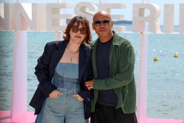 French actor Eric Judor (R) and french actress Sophie Marie Larrouy poses during the "A bientot te revoir" photocall as part of the 9th edition of the Cannes international Series Festival (Canneseries) in Cannes, southern France, on April 25, 2026. (Photo by Valery HACHE / AFP)