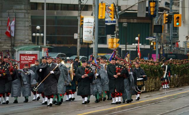 Soldiers and veterans of the 48th Highlanders of Canada march in the annual Freedom of the City Parade in Toronto, on April 25, 2026. The 48th Highlanders of Canada is an active Canadian Forces Primary Reserve infantry regiment formed in 1891 that fought in both World Wars. Freedom of the City is a prestigious honour granted to military units with long-standing ties to a municipality. Rooted in a 15th-century English tradition, the ceremony remains significant in the Canadian Army today. This year also marks the 135th anniversary of the 48th Highlanders. (Photo by Peter POWER / AFP)