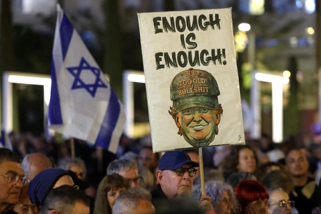 Israeli left-wing activists demonstrate in HaBima Square against the ongoing war with Iran and against the Israeli government, in Tel Aviv on April 25, 2026. Since the ceasefire between Israel, the United States, and Iran came into effect, a relative calm has prevailed, with no bombings reported in Iran or the Gulf, after five weeks of conflict that left thousands dead, primarily in Iran and Lebanon. (Photo by Jack GUEZ / AFP) / 