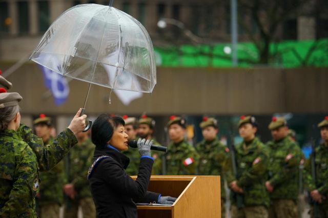 Toronto Mayor Olivia Chow addresses the troops during the 48th Highlanders of Canada Freedom of the City parade and ceremony in Toronto, on April 25, 2026. The 48th Highlanders of Canada is an active Canadian Forces Primary Reserve infantry regiment formed in 1891 that fought in both World Wars. Freedom of the City is a prestigious honour granted to military units with long-standing ties to a municipality. Rooted in a 15th-century English tradition, the ceremony remains significant in the Canadian Army today. This year also marks the 135th anniversary of the 48th Highlanders. (Photo by Peter POWER / AFP)