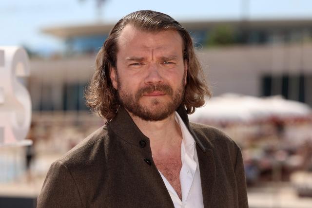 Danish actors Pilou Asbaek poses during the "Snake killer" photocall as part of the 9th edition of the Cannes international Series Festival (Canneseries) in Cannes, southern France, on April 25, 2026. (Photo by Valery HACHE / AFP)