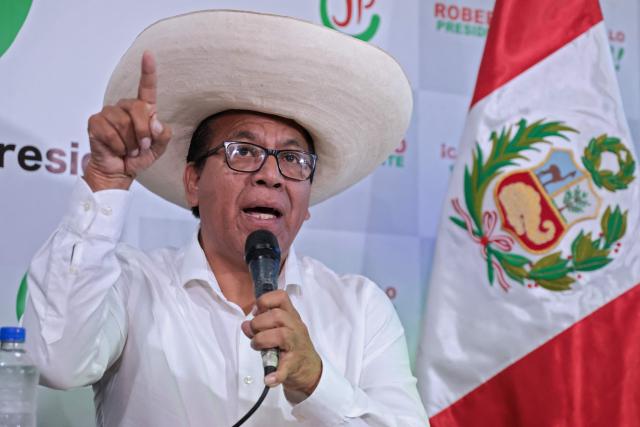 Peruvian presidential candidate for the Juntos por el Peru party, Roberto Sanchez, speaks during a press conference at the party's headquarters in Lima on April 25, 2026. (Photo by Connie FRANCE / AFP)