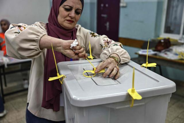 Palestinian electoral employees begin counting votes in the municipal elections after the close of polling stations in the Israeli-occupied West Bank city of Al-Bireh on April 25, 2026. Palestinians in the West Bank and a central area of Gaza began voting on April 25 in municipal elections in a first vote since the Gaza war, marked by a narrow political field and widespread disillusionment. (Photo by Zain JAAFAR / AFP)