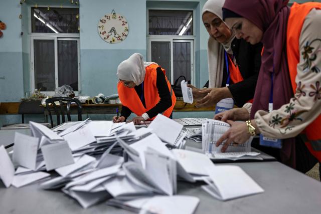 Palestinian electoral workers begin counting votes after the close of polling stations in the Israeli-occupied West Bank city of Al-Bireh on April 25, 2026. Palestinians in the West Bank and a central area of Gaza began voting on April 25 in municipal elections in a first vote since the Gaza war, marked by a narrow political field and widespread disillusionment. (Photo by Zain JAAFAR / AFP)