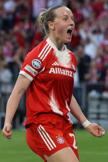 Bayern Munich's German forward #20 Franziska Kett celebrates scoring the 1-1 goal during the UEFA Women's Champions League semi-final first leg football match between FC Bayern Munich and FC Barcelona in Munich, southern Germany on April 25, 2026. (Photo by Karl-Josef HILDENBRAND / AFP)