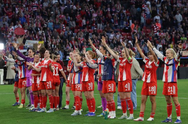 Bayern players celebrate with their fans after the UEFA Women's Champions League semi-final first leg football match between FC Bayern Munich and FC Barcelona in Munich, southern Germany on April 25, 2026. (Photo by Karl-Josef HILDENBRAND / AFP)