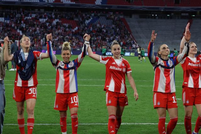 Bayern players celebrate with their fans after the UEFA Women's Champions League semi-final first leg football match between FC Bayern Munich and FC Barcelona in Munich, southern Germany on April 25, 2026. (Photo by Karl-Josef HILDENBRAND / AFP)