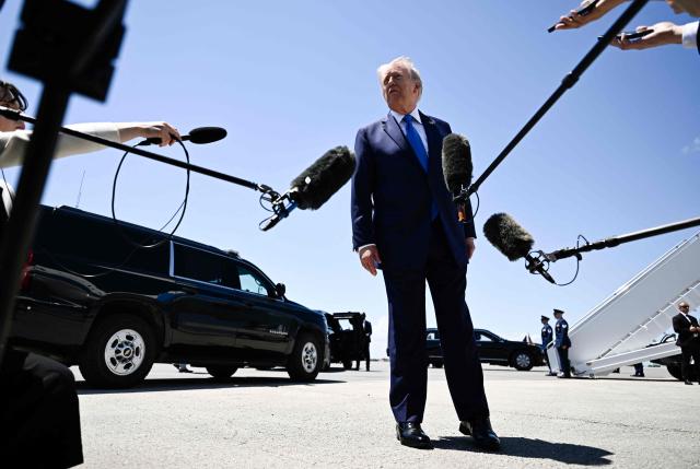 US President Donald Trump speaks to journalists before boarding Air Force One at Palm Beach International Airport in West Palm Beach, Florida, on April 25, 2026. President Trump is on his way back to Washington where he will be attending the White House Correspondents' dinner for the first time while in office. (Photo by Kent NISHIMURA / AFP)