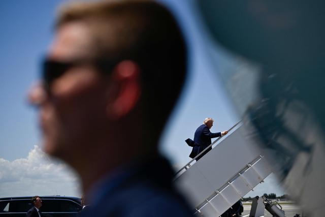 US President Donald Trump boards Air Force One at Palm Beach International Airport in West Palm Beach, Florida, on April 25, 2026. President Trump is on his way back to Washington where he will be attending the White House Correspondents' dinner for the first time while in office. (Photo by Kent NISHIMURA / AFP)