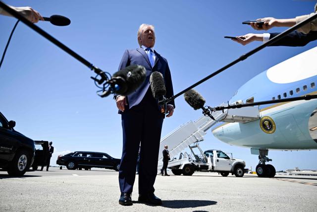 US President Donald Trump speaks to journalists before boarding Air Force One at Palm Beach International Airport in West Palm Beach, Florida, on April 25, 2026. President Trump is on his way back to Washington where he will be attending the White House Correspondents' dinner for the first time while in office. (Photo by Kent NISHIMURA / AFP)