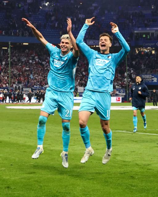 Hoffenheim's Kosovar-Swiss defender #21 Albian Hajdari (L) and Hoffenheim's German forward #11 Fisnik Asllani celebrate after winning the German first division Bundesliga football match between Hamburger SV and TSG 1899 Hoffenheim in Hamburg, northern Germany on April 25, 2026. Hoffenheim won the match 2-1. (Photo by Ibrahim OT / AFP) / DFL REGULATIONS PROHIBIT ANY USE OF PHOTOGRAPHS AS IMAGE SEQUENCES AND/OR QUASI-VIDEO