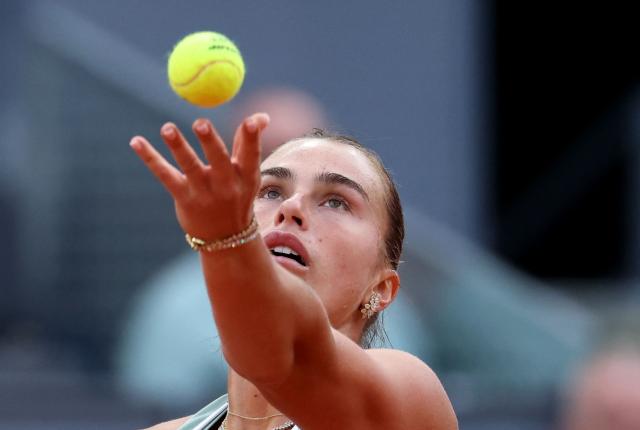 Belarus' Aryna Sabalenka serves to Romania’s Jacqueline Cristian during their 2026 WTA Tour Madrid Open tennis tournament third round singles match at the Caja Magica in Madrid, on April 25, 2026. (Photo by Thomas COEX / AFP)