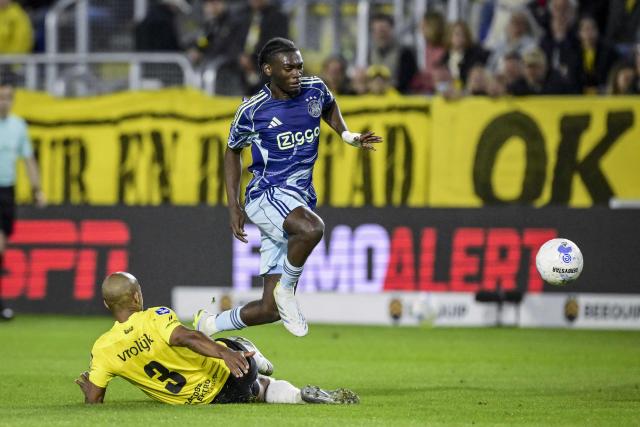 NAC Breda's Belgian defender #03 Denis Odoi (L) and Ajax's Belgian midfielder #24 Jorthy Mokio (R) fight for the ball during the Dutch Eredivisie football match between NAC Breda and Ajax at the Rat Verlegh Stadium in Breda on April 25, 2026. (Photo by Olaf Kraak / ANP / AFP) / Netherlands OUT
