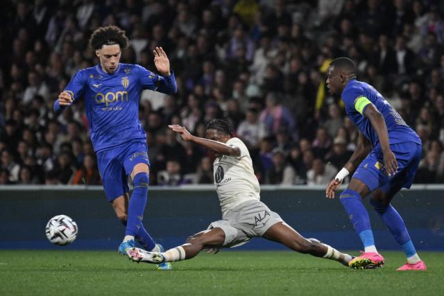 Monaco's French midfielder #11 Maghnes Akliouche (L) and Toulouse's Senegalese midfielder #18 Pape Demba Diop (C) fight for the ball during the French L1 football match between Toulouse FC and AS Monaco at the TFC Stadium in Toulouse, southwestern France, on April 25, 2026. (Photo by Ed JONES / AFP)