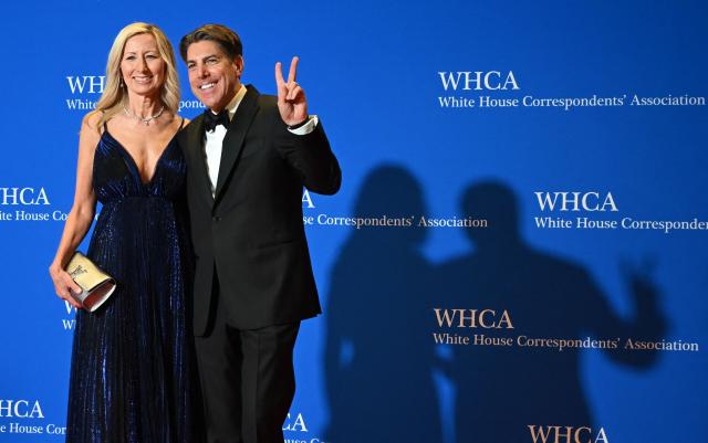 US journalist Jon Decker and his wife Caroline Decker attend the White House Correspondents' dinner at the Washington Hilton in Washington, DC, on April 25, 2026. US President Donald Trump is attending the annual gala of the political press for the first time while in office. (Photo by Alex WROBLEWSKI / AFP)