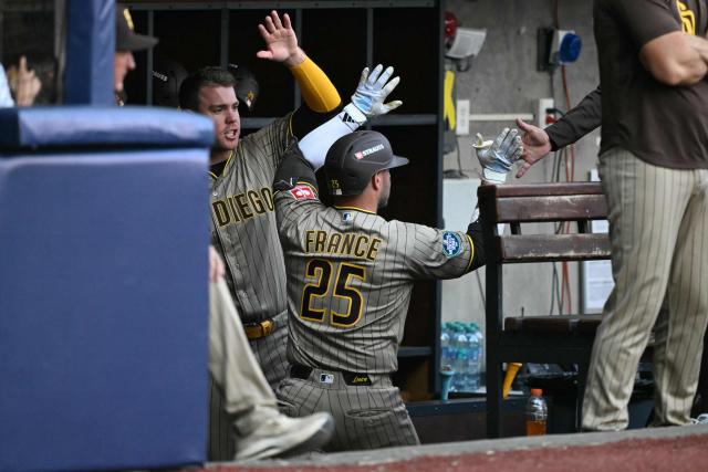San Diego Padres' #25 Ty France celebrates with teammates after scoring a run during the MLB World Tour Mexico City Series game between San Diego Padres and Arizona Diamondbacks at Alfredo Harp Helu Stadium in Mexico City on April 25, 2026. (Photo by YURI CORTEZ / AFP)