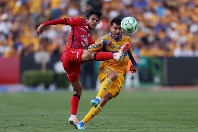 Mazatlan's midfielder #25 Said Godinez (L) and Tigres' Argentine forward #07 Angel Correa fight for the ball during the Liga MX Clausura football match between Tigres and Mazatlan at Universitario de la UANL Stadium in Monterrey, Nuevo Leon state, Mexico, on April 25, 2026. (Photo by Julio Cesar AGUILAR / AFP)