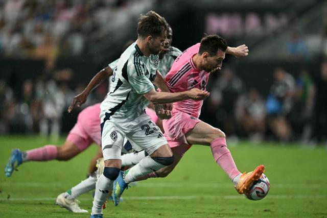 Inter Miami's Argentine forward #10 Lionel Messi fights for the ball with New England’s US defender #23 Will Sands and New England’s US defender #02 Mamadou Fofana during a Major League Soccer (MLS) regular season football match between Inter Miami CF and New England Revolution at NU Stadium in Miami, on April 25, 2026. (Photo by CHANDAN KHANNA / AFP)