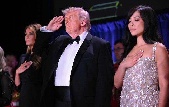 (L/R) US First Lady Melania Trump, US President Donald Trump and CBS News senior White House correspondent Weijia Jiang attend the White House Correspondents' dinner at the Washington Hilton in Washington, DC, on April 25, 2026. President Trump is attending the annual gala of the political press for the first time while in office. (Photo by Mandel NGAN / AFP)