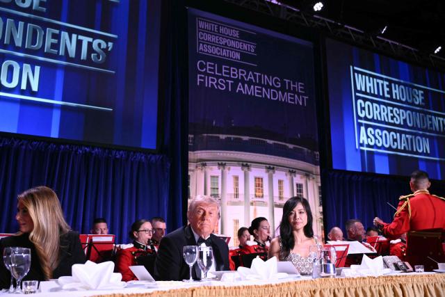 (L/R) US First Lady Melania Trump, US President Donald Trump and CBS News senior White House correspondent Weijia Jiang attend the White House Correspondents' dinner at the Washington Hilton in Washington, DC, on April 25, 2026. President Trump is attending the annual gala of the political press for the first time while in office. (Photo by Mandel NGAN / AFP)