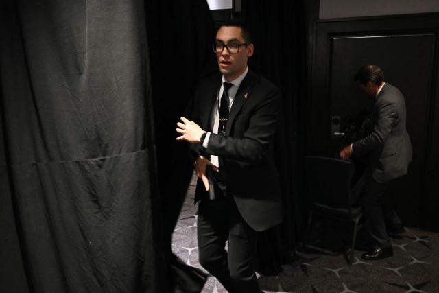 Agents draw their guns after loud bangs were heard during the White House Correspondents' dinner at the Washington Hilton in Washington, DC, on April 25, 2026. Shots were fired as US President Donald Trump attended a press dinner in Washington on Saturday night, witnesses and AFP reporters confirmed. Loud bangs were heard and guests at the black-tie White House Correspondents' Dinner scrambled to hide under tables. (Photo by Mandel NGAN / AFP)