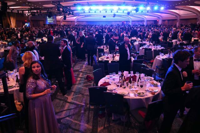 Attendees are seen inside the ballroom after shots were reportedly fired during the White House Correspondents' dinner at the Washington Hilton in Washington, DC, on April 25, 2026. Shots were allegedly fired as US President Donald Trump attended a press dinner in Washington on Saturday night, witnesses and AFP reporters said as loud bangs were heard at the hotel venue. (Photo by Mandel NGAN / AFP)