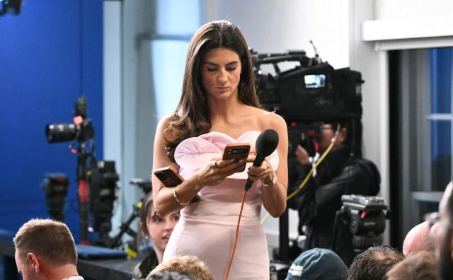 CNN journalist Kaitlan Collins works ahead of a press briefing by US President Donald Trump in the Brady Briefing Room at the White House in Washington, DC, following a shooting incident at the White House Correspondents Dinner on April 25, 2026. US President Donald Trump said April 25 he would give a press conference from the White House press briefing room, shortly after a shooting incident at a gala dinner in Washington. The press conference is set to take place shortly after 10 p.m. (0200 GMT), Trump wrote on his Truth Social platform, adding: "The First Lady, plus the Vice President, and all Cabinet members, are in perfect condition." (Photo by Mandel NGAN / AFP)