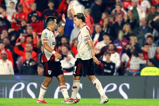 River Plate's forward #11 Facundo Colidio (R) celebrates with teammate defender #21 Marcos Acuna after scoring his team's second goal during the Argentine Professional Football League 2026 Apertura Tournament match between River Plate and Aldosivi at Monumental Stadium in Buenos Aires on April 25, 2026. (Photo by ALEJANDRO PAGNI / AFP)