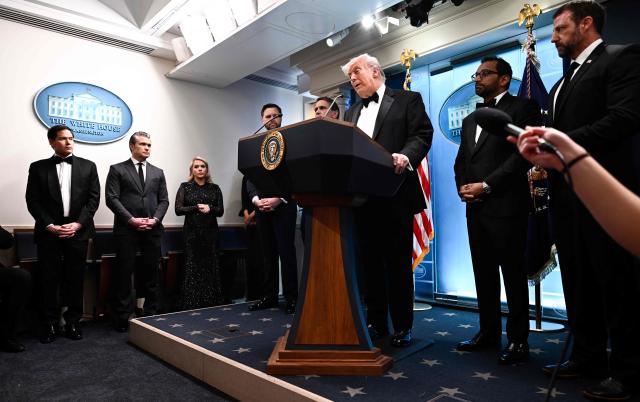 US President Donald Trump speaks flanked by US Vice President JD Vance, FBI Director Kash Patel, US Secretary of Homeland Security Markwayne Mullin, Acting Attorney General Todd Blanche, White House Press Secretary Karoline Leavitt, US Secretary of Defense Pete Hegseth and US Secretary of State Marco Rubio during a press briefing in the Brady Briefing Room at the White House in Washington, DC, shortly after a shooting incident at the White House Correspondents Dinner on April 25, 2026. US President Donald Trump said April 25 he would give a press conference from the White House press briefing room, shortly after a shooting incident at a gala dinner in Washington. The press conference is set to take place shortly after 10 p.m. (0200 GMT), Trump wrote on his Truth Social platform, adding: "The First Lady, plus the Vice President, and all Cabinet members, are in perfect condition." (Photo by Kent NISHIMURA / AFP)