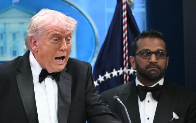 US President Donald Trump speaks flanked by FBI Director Kash Patel during a press briefing in the Brady Briefing Room at the White House in Washington, DC, shortly after a shooting incident at the White House Correspondents Dinner on April 25, 2026. US President Donald Trump said April 25 he would give a press conference from the White House press briefing room, shortly after a shooting incident at a gala dinner in Washington. The press conference is set to take place shortly after 10 p.m. (0200 GMT), Trump wrote on his Truth Social platform, adding: "The First Lady, plus the Vice President, and all Cabinet members, are in perfect condition." (Photo by Mandel NGAN / AFP)