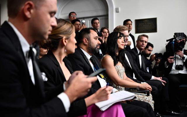Reporters including CBS News senior White House correspondent Weijia Jiang (C) listen as US President Donald Trump speaks during a press briefing in the Brady Briefing Room at the White House in Washington, DC, shortly after a shooting incident at the White House Correspondents Dinner on April 25, 2026. US President Donald Trump said April 25 he would give a press conference from the White House press briefing room, shortly after a shooting incident at a gala dinner in Washington. The press conference is set to take place shortly after 10 p.m. (0200 GMT), Trump wrote on his Truth Social platform, adding: "The First Lady, plus the Vice President, and all Cabinet members, are in perfect condition." (Photo by Kent NISHIMURA / AFP)