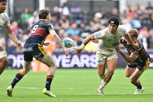 Moana Pasifika's Glen Vaihu (2nd R) is tackled by Highlanders' Cameron Millar (R) during the Super Rugby Pacific match between the Highlanders and Moana Pasifika at One New Zealand Stadium in Christchurch on April 26, 2026. (Photo by Sanka VIDANAGAMA / AFP)